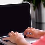 typing on laptop